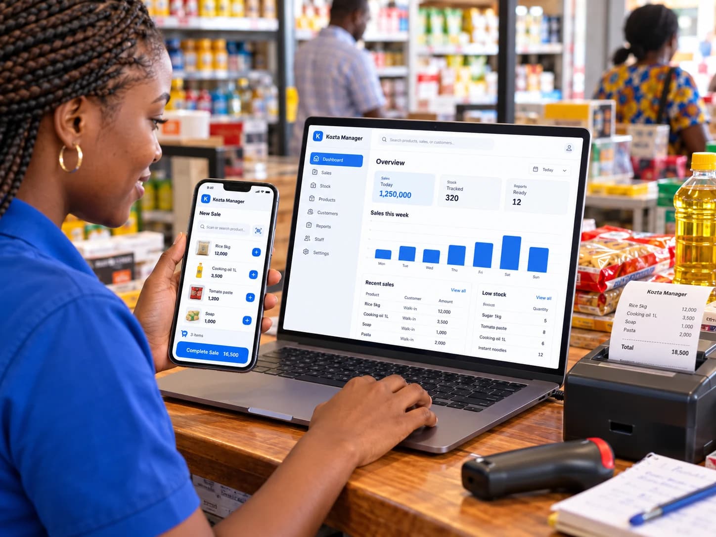 African supermarket worker using Kozta Manager on a smartphone and laptop at the counter